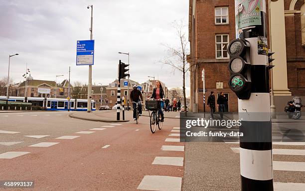 bicycle traffic light in amsterdam - cycling netherlands stock pictures, royalty-free photos & images