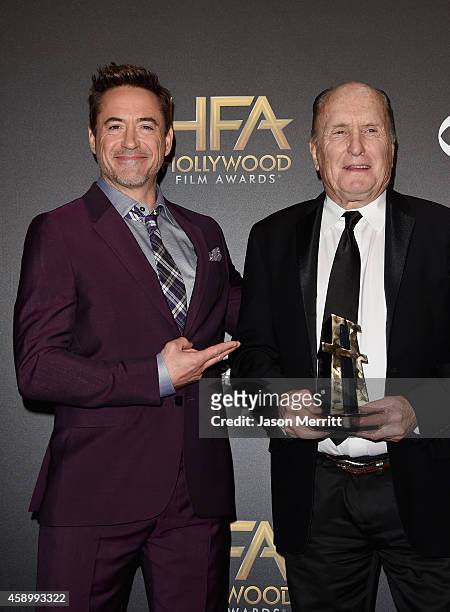 Actors and Robert Downey Jr. And Robert Duvall, winner of Hollywood Supporting Actor for 'The Judge,' pose in the press room during the 18th Annual...