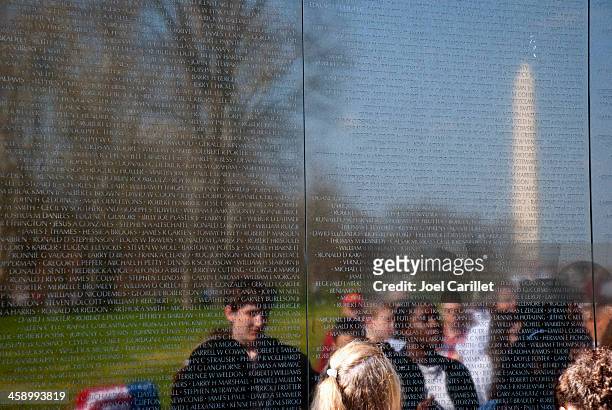 washington monument reflected in the vietnam veterans memorial - vietnam memorial stock pictures, royalty-free photos & images