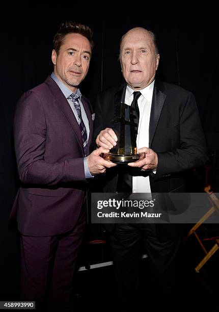 Actors Robert Downey Jr. And Robert Duvall pose with the Hollywood Supporting Actor Award for 'The Judge' backstage during the 18th Annual Hollywood...