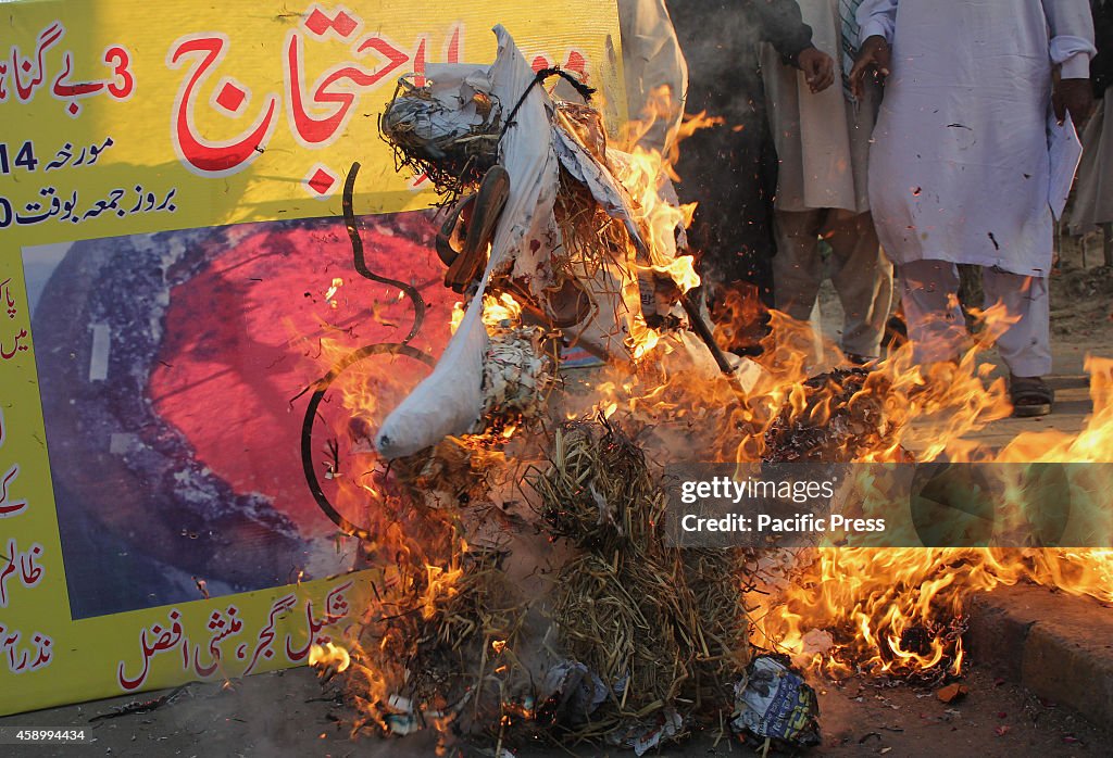 Activists from Pakistan Minorities Movement burn effigy of...