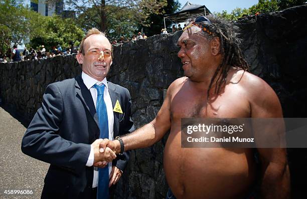 Man depicting Australian Prime Minster Tony Abbott greets an Indigenous Australian during a protests against G20 leaders on November 15, 2014 in...