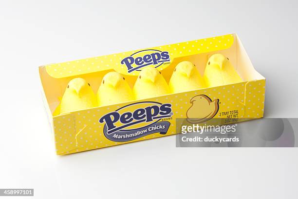 peeps yellow marshmallow chicks in package - marshmallow peeps stock pictures, royalty-free photos & images