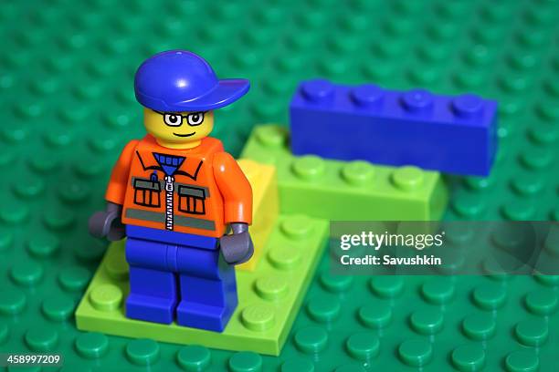 lego man figure - guy playing with lego stock pictures, royalty-free photos & images