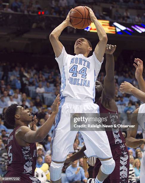 North Carolina's Justin Jackson muscles his way to the basket against North Carolina Central's Anthony McDonald during the first half on Friday, Nov....