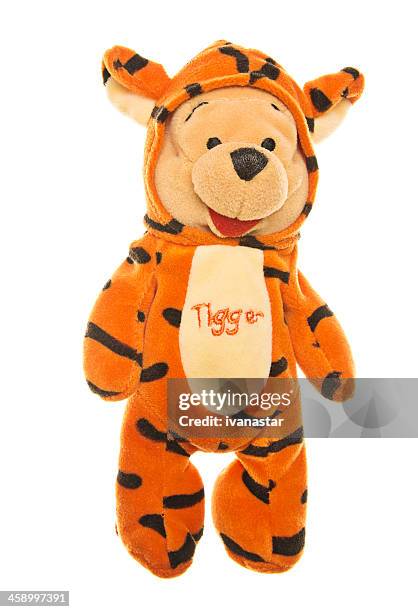 winnie-the-pooh teddy bear in tigger costume - winnie pooh stock pictures, royalty-free photos & images