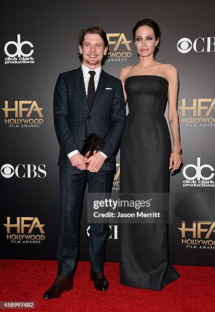 Actor Jack O'Connell, winner of New Hollywood award for 'Unbroken,' and actress/director Angelina Jolie pose in the press room during the 18th Annual...