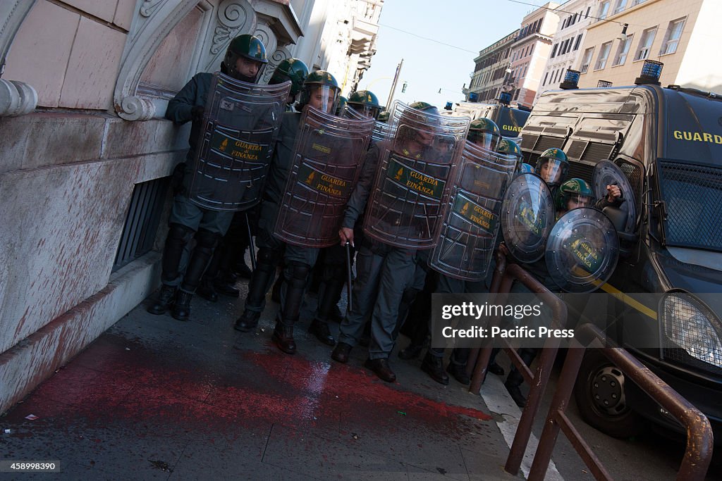 Riot police deployed to the passage of the demonstration and...