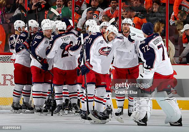 Nick Foligno of the Columbus Blue Jackets and the rest of his teammates celebrate the win over the Philadelphia Flyers on November 14, 2014 at the...