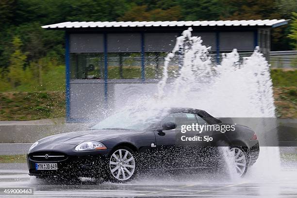 jaguar xkr skidding - sked stock pictures, royalty-free photos & images