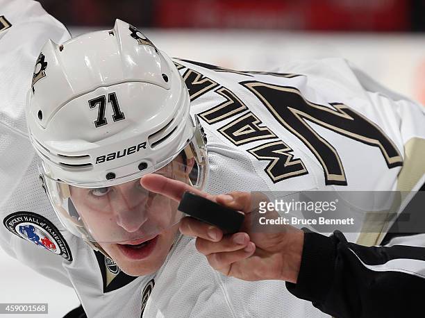 Evgeni Malkin of the Pittsburgh Penguins keeps his eyes on the puck during the game against the Toronto Maple Leafs at the Air Canada Centre on...