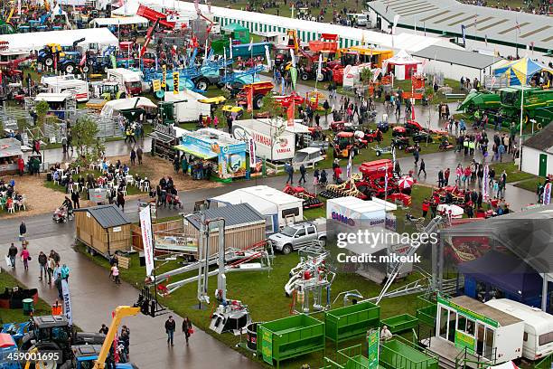 tents and exhibits at agricultural show - agricultural machinery exhibition stock pictures, royalty-free photos & images