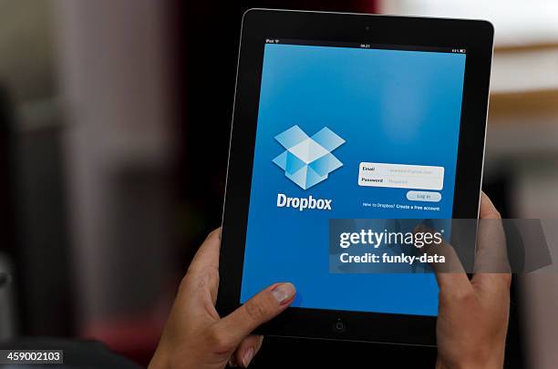 ipad device with dropbox app - dropbox stock pictures, royalty-free photos & images