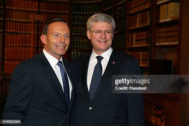 In this handout photo provided by the G20 Australia, Australia's Prime Minister Tony Abbott greets Canada's Prime Minister Stephen Harper in the...