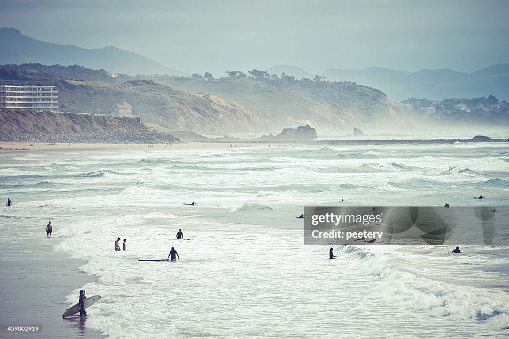 Surfers at the beach.