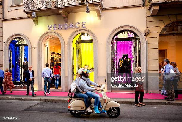 versace store - milan, italy - milan fashion stock pictures, royalty-free photos & images