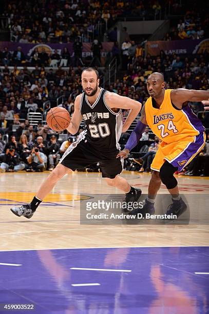Manu Ginobili of the San Antonio Spurs handles the ball against Kobe Bryant of the Los Angeles Lakers on November 14, 2014 at Staples Center in Los...