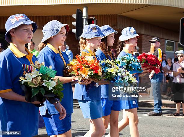 australian school children marching on anzac day - anzac day stock pictures, royalty-free photos & images