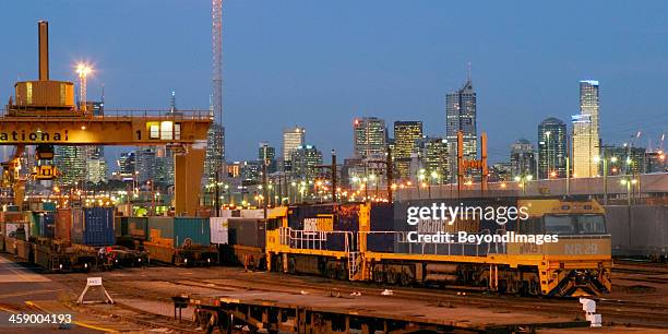 loaded pacific national freight train at night in city terminal - train yard at night stock pictures, royalty-free photos & images