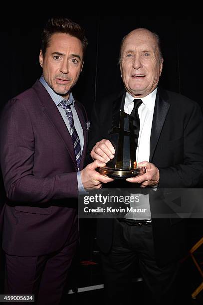 Actors Robert Downey Jr. And Robert Duvall pose with the Hollywood Supporting Actor Award for 'The Judge' backstage during the 18th Annual Hollywood...