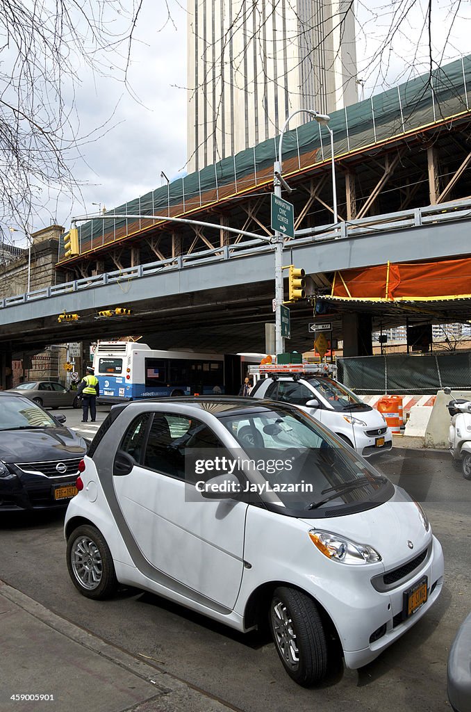 Two Smart Cars, scooter, Urban parking spaces, Lower Manhattan, NYC