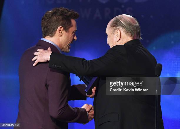 Actor Robert Duvall accepts the Hollywood Supporting Actor Award for 'The Judge' from actor Robert Downey Jr. Onstage during the 18th Annual...