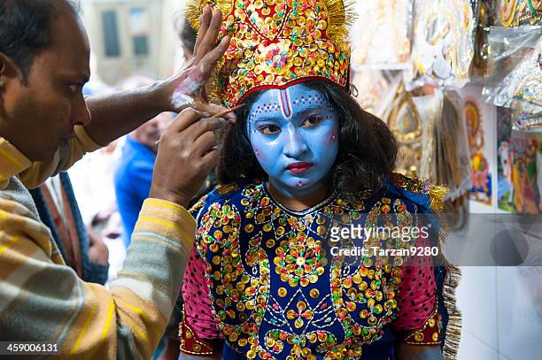 girl dressing and making up as krishna in old dhaka - krishna bildbanksfoton och bilder