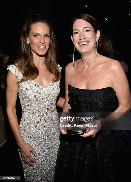 Actress Hilary Swank and writer Gillian Flynn pose with the Hollywood Screenwriter Award for 'Gone Girl' backstage during the 18th Annual Hollywood...