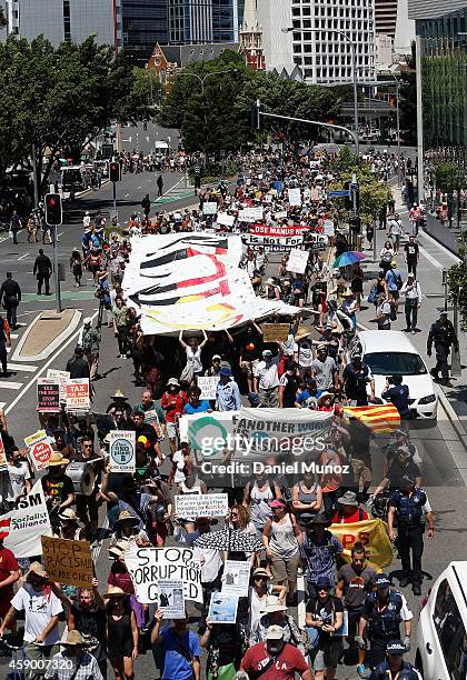 Thousands of people march during a protests against G20 summit on November 15, 2014 in Brisbane, Australia. World leaders have gathered in Brisbane...