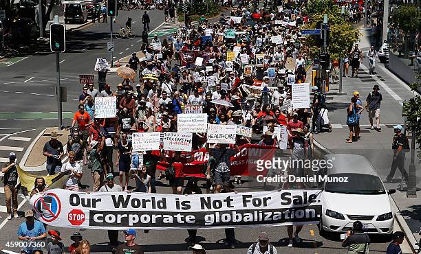Thousands of people march during a protests against G20 summit on November 15, 2014 in Brisbane, Australia. World leaders have gathered in Brisbane...