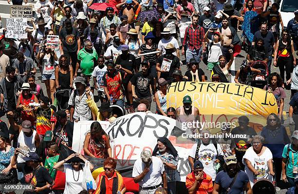 Thousands of people march during a protests against G20 summit on November 15, 2014 in Brisbane, Australia. World leaders have gathered in Brisbane...