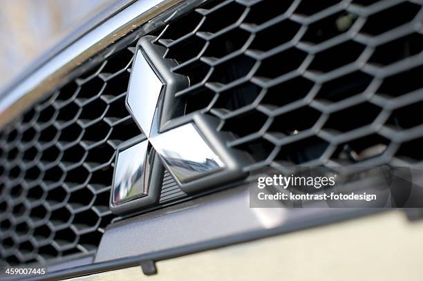 mitsubishi grid - mitsubishi logo stock pictures, royalty-free photos & images