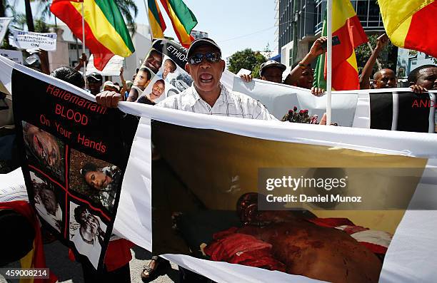 Man shouts slogans against genocide in Ethiopia during a protest against G20 leaders on November 15, 2014 in Brisbane, Australia. World leaders have...