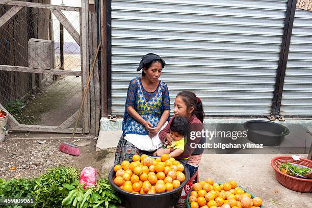 guatemalan woman with her children - guatemalan culture stock pictures, royalty-free photos & images
