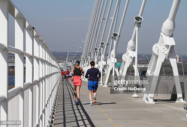 runners on arthur ravenel bridge in charleston - mount pleasant south carolina stock pictures, royalty-free photos & images