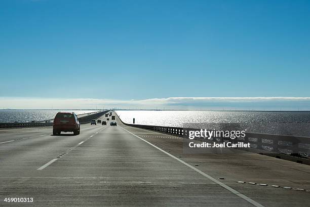 driving on i-10, crossing lake pontchartrain enroute to new orleans - interstate 10 stock pictures, royalty-free photos & images