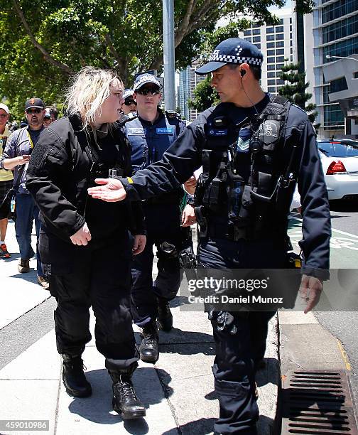 Woman is arrested by police under temporary G20 laws during a protest against G20 leaders on November 15, 2014 in Brisbane, Australia. World leaders...