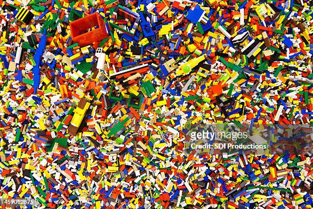 pile of laid out lego pieces - lego blocks stock pictures, royalty-free photos & images