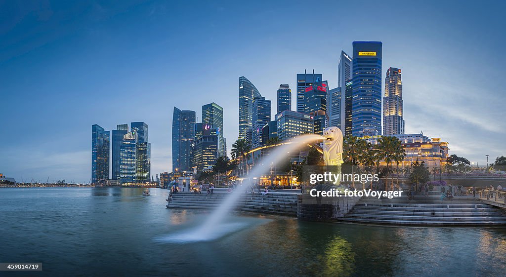 Singapore Merlion Fountain CBD skyscrapers overlooking Marina Bay at dusk