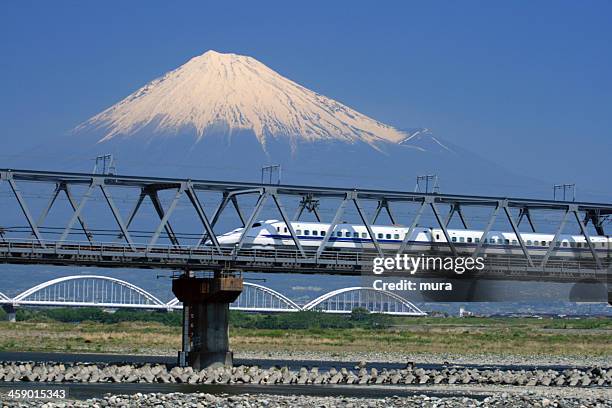 shinkansen bullet train passing near the mountain fuji - bullet speeding stock pictures, royalty-free photos & images