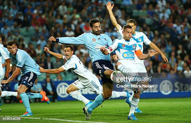 Sasa Ognenovski of Sydney and Leigh Broxham of the Victory contest possession during the round six A-League match between Sydney FC and Melbourne...