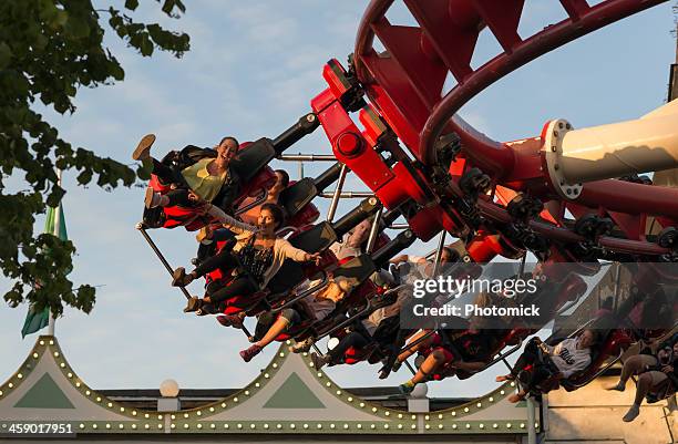 riders scream on a ride at stockholm's grona lund - young woman screaming on a rollercoaster stock pictures, royalty-free photos & images