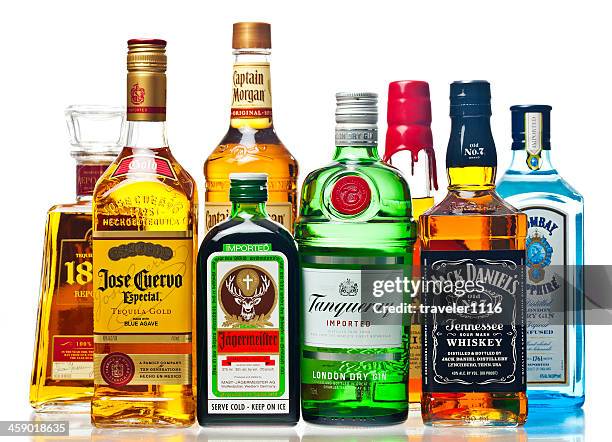 liquor bottles on a white background - merknaam stockfoto's en -beelden