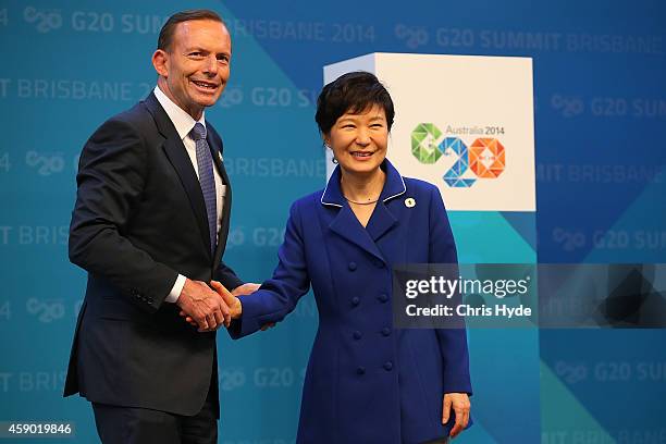 Australian Prime Minister Tony Abbott greets Republic of Korea's President Park Geun-hye during the official welcome at the Brisbane Convention and...