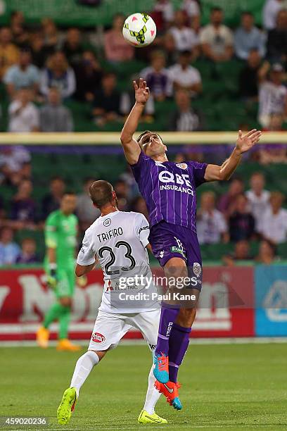 Richard Garcia of the Glory and Jason Trifiro of the Wanderers contest a header during the round six A-League match between the Perth Glory and...
