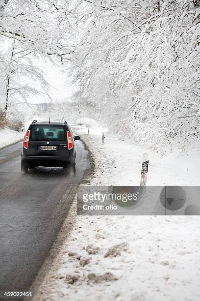 road with car in winter forest - hoar frost - skoda auto stock pictures, royalty-free photos & images