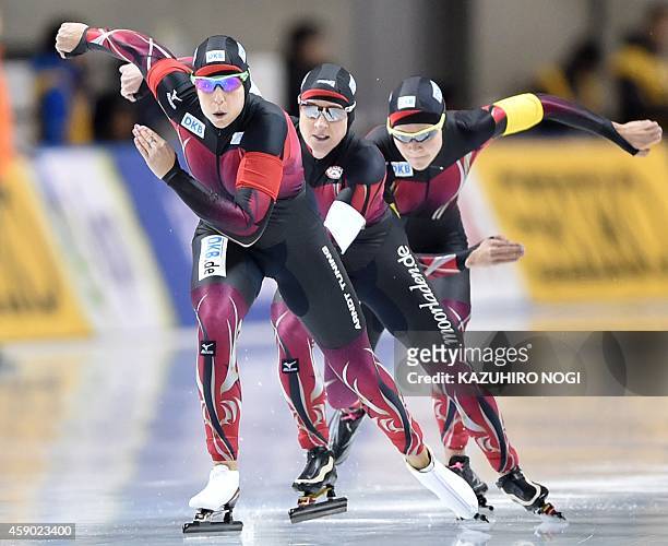Speed skaters Bente Kraus, Claudia Pechstein and Gabriele Hirschbichler of Germany skate in the women's team pursuit Division A at the ISU World Cup...