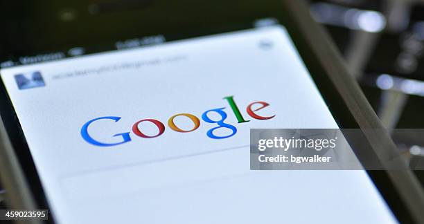 google app on iphone - search engine stock pictures, royalty-free photos & images