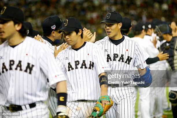 Members of the Samurai Japan celebrate defeating and no-hitting the MLB All-Stars at the Tokyo Dome during the Japan All-Star Series on Saturday,...