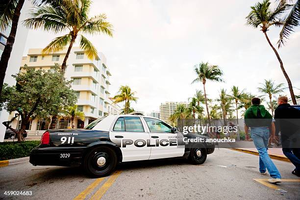 police car blocking ocean drive for holidays, miami beach - police road block stock pictures, royalty-free photos & images